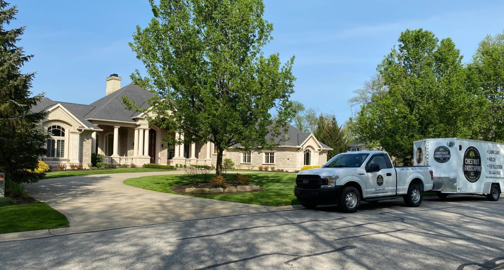 Chestnut Landscaping truck in front of happy client's yard